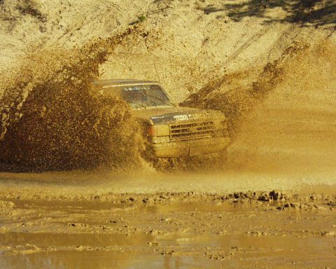1989 Ford Bronco - This 1989 Ford Bronco is navigating a challenging muddy terrain.