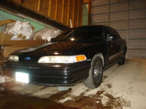 1992 Ford Crown Victoria - Black 1992 Ford Crown Victoria parked indoors, showing its front and side profile.