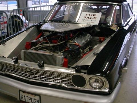 1972 Ford Ranchero - This modified race car, possibly a 1964 Galaxie, features a powerful engine and is for sale. Another race car is visible in the background.