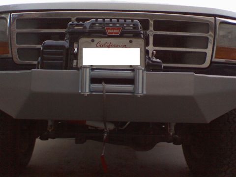 1994 Ford Bronco - This Ford truck features an aftermarket bumper with a WARN winch and a California license plate.