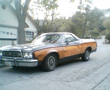 1973 Ford Ranchero - This 1973 Ford Ranchero features a distinctive two-tone paint scheme with wood paneling accents and a bold front grille.