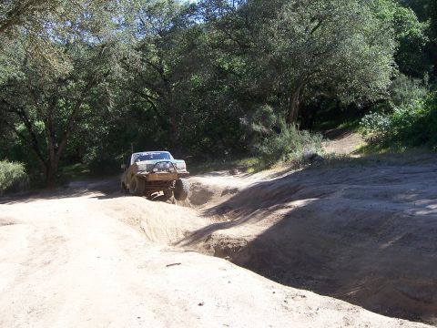1991 Ford Bronco - 1991 Ford Bronco tackling an off-road trail during a weekend event.