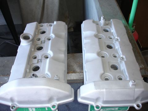 1992 Ford Taurus - Pair of silver valve covers, possibly for an engine rebuild or modification.