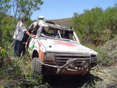1992 Ford Explorer - This heavily modified off-road vehicle appears to have sustained significant damage during a race.