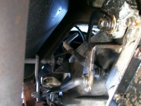 1984 Ford Bronco - Close-up view of the transmission linkage and associated hardware.