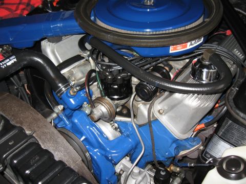 1968 Shelby GT500 - The engine bay features a blue painted engine block, air cleaner, and hoses, with various metal components visible.