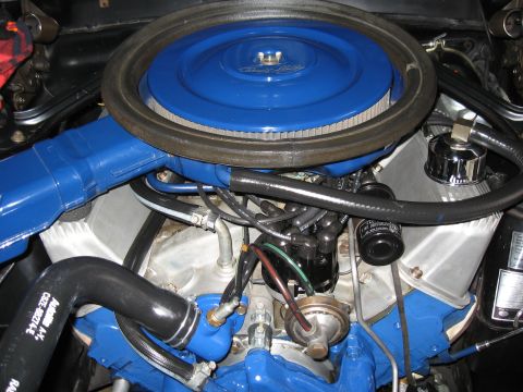 1968 Shelby GT500 - Close-up view of a vehicle's engine bay, highlighting blue painted components and engine parts.