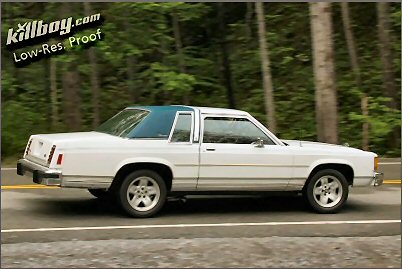 1985 Ford LTD Crown Victoria - Side view of a white 1985 Ford Crown Victoria LTD coupe with a blue roof, captured on a scenic road.