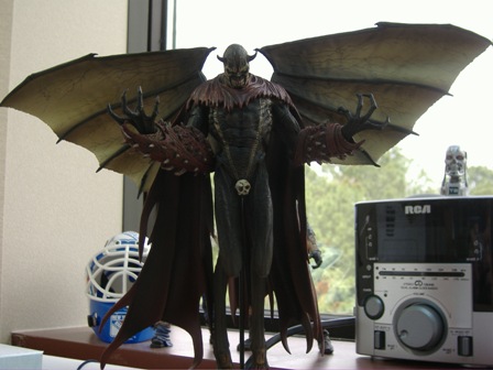 1991 Ford Bronco - A toy figure of a winged demon stands on a shelf next to an RCA radio and a hockey mask.