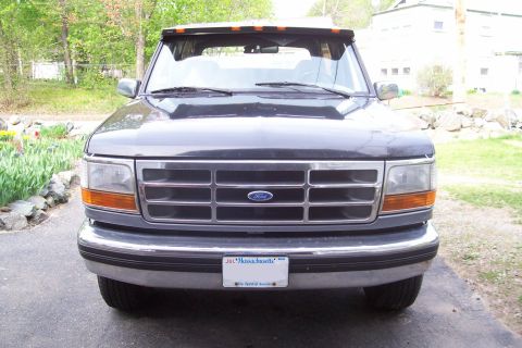 1995 Ford Bronco - The front grille and headlights of a 1995 Ford Bronco are visible in this front-facing photograph.