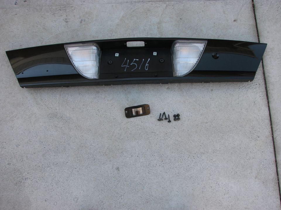 Black rear bumper trim panel with lights and handwritten '4516'