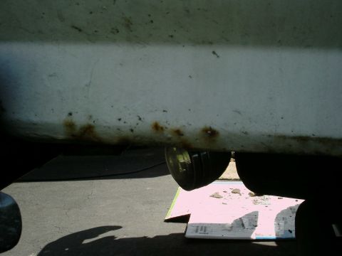 1988 Ford Bronco - Rust is forming along the bottom edge of this vehicle's body panel, indicating potential corrosion issues.