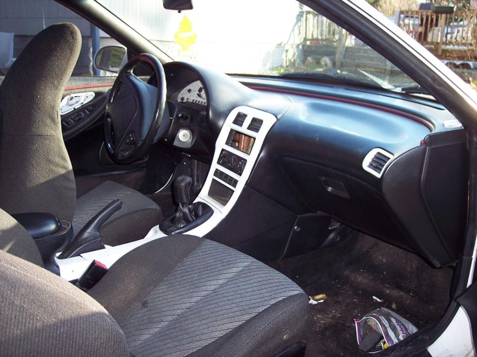 1993 Ford Probe interior showing dashboard, steering wheel, seats, and center console