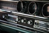 1965 Pontiac Catalina - Dashboard of a 1965 Pontiac Catalina, the original radio and auxiliary gauges.