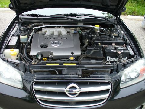 1991 Ford Probe - The engine bay of a Nissan vehicle is shown with the hood open, revealing the V6 3.5 engine.