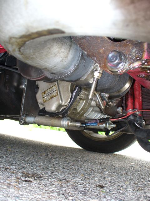1991 Ford Probe - Underside view of turbocharger and exhaust system, showing custom piping and suspension parts.