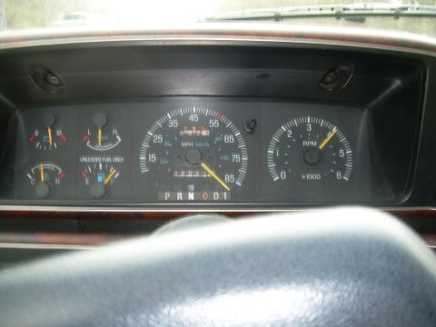 1988 Ford Bronco - The dashboard displays the vehicle's speed, engine RPM, fuel level, and temperature gauges.