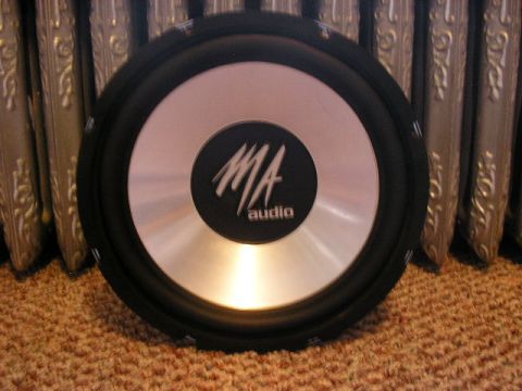1994 Ford Probe - Subwoofer with MA audio branding is shown against a decorative background.