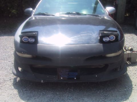 1993 Ford Probe - Front view of a 1993 Ford Probe, showing its distinctive pop-up headlights and modified bumper.