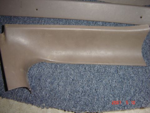 1993 Ford Bronco - Interior trim piece shown on carpet.
