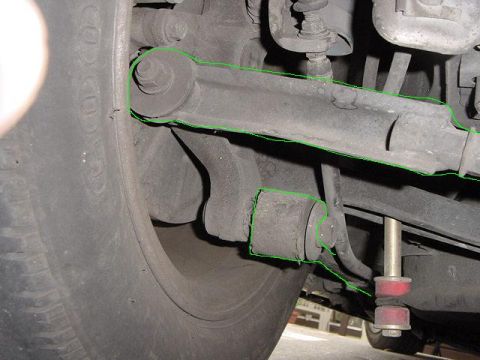 1992 Ford Probe - Undercarriage view of a vehicle's suspension system, focusing on the rear axle components.