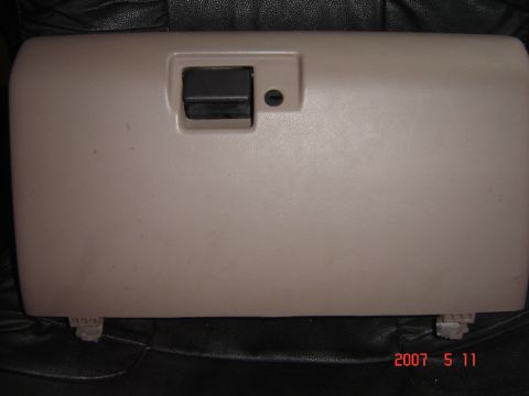 1993 Ford Bronco - Glove box door from a vehicle interior. The registry claims it is from a 1993 Ford Bronco, but this cannot be confirmed from the image.
