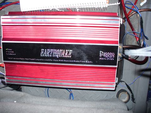 1991 Ford Probe - Earthquake P5000 Mono Block amplifier installed with visible wiring.