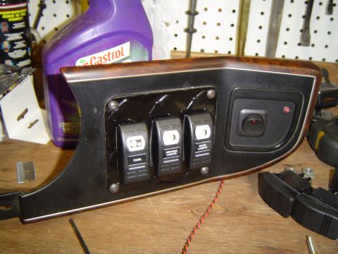 1989 Ford Bronco - Custom dashboard switch panel with labels for fans, driving lights, and rock lights, likely for aftermarket accessory control.