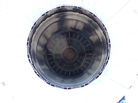 1991 Ford Probe - View inside a large exhaust pipe opening, showing its internal structure.