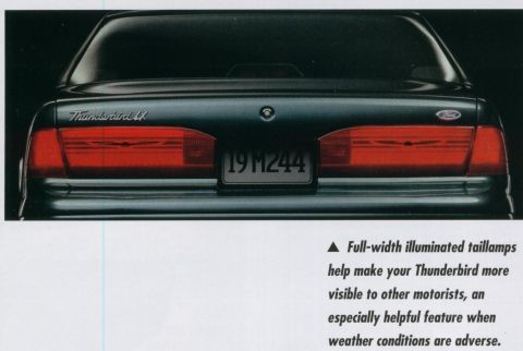 1995 Ford Thunderbird - Rear view of a 1994 Ford Thunderbird, highlighting its full-width illuminated taillamps.