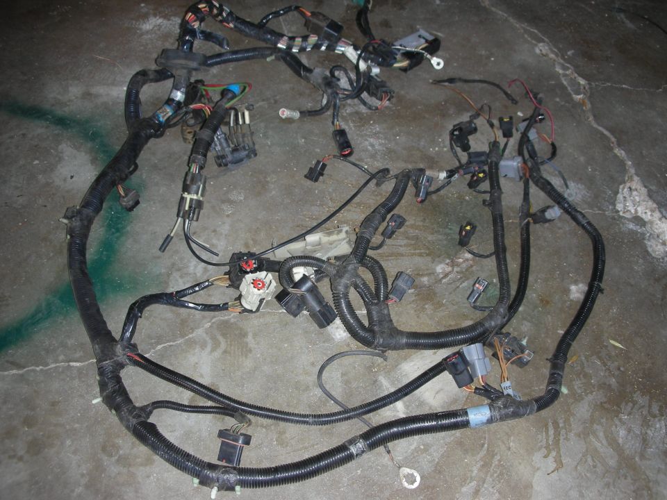 Automotive wiring harness spread out on concrete floor