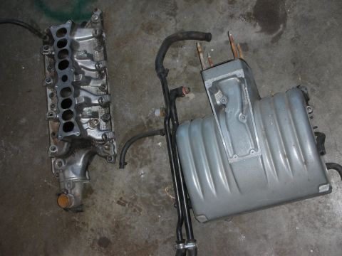 1998 Ford Crown Victoria - Engine intake manifold and plenum assembly with hoses, likely for a V8 engine.