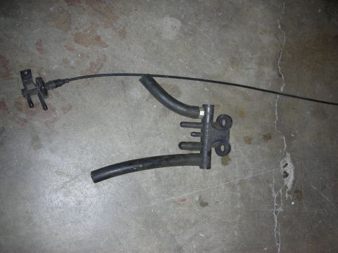 1998 Ford Crown Victoria - A vacuum hose assembly is shown against a concrete background.