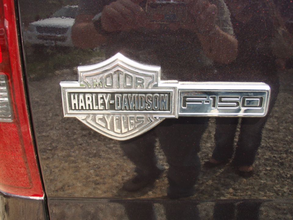 Close-up of a Harley-Davidson Cycles badge on an F-150 truck