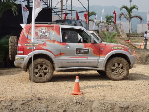 1995 Ford F-150 - A muddy Mitsubishi Montero 4x4 participates in an off-road challenge event.
