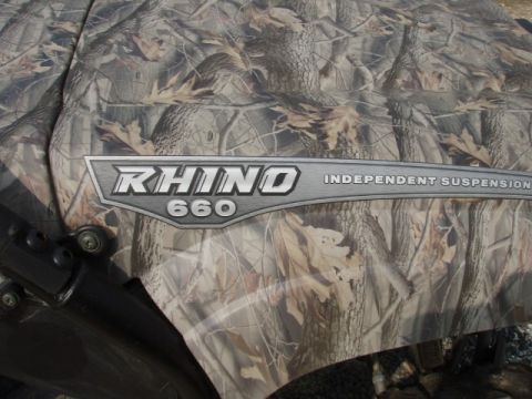 1995 Ford F-150 - Close-up of a camo-patterned side panel on a Yamaha Rhino 660, indicating independent suspension.