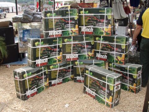 1995 Ford F-150 - Multiple boxes of Ironman electric winches are displayed outdoors.