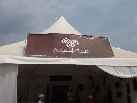 1995 Ford F-150 - A large tent displays a banner for the Aladdin Hotel, with its website address visible below the logo.