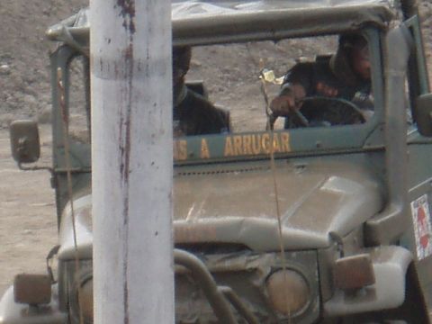 1995 Ford F-150 - A driver is visible behind the wheel of a vintage Toyota Land Cruiser FJ40.