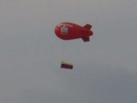 1995 Ford F-150 - A red blimp with logos and a small flag flies in the sky. Supermotors.net logo is visible.