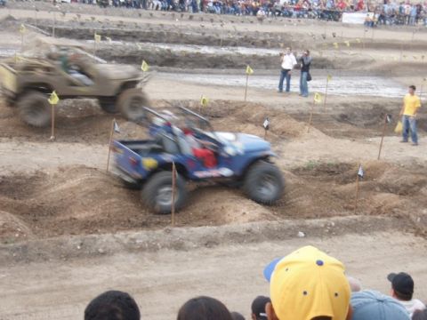 1995 Ford F-150 - Modified jeeps navigate a challenging off-road course during a competition.