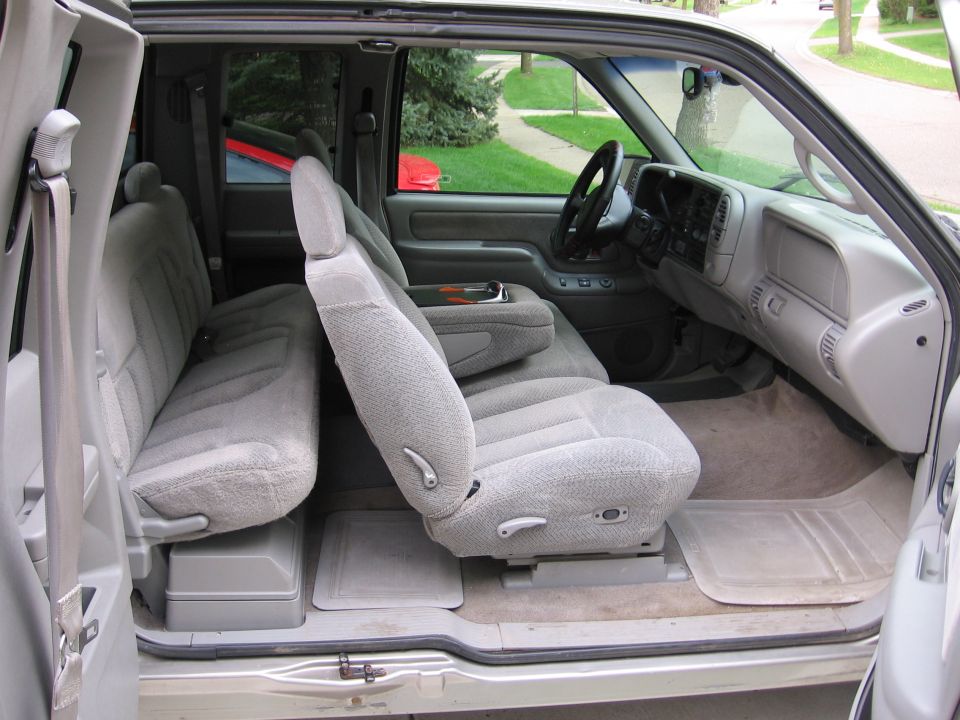 Gray cloth interior of an extended-cab pickup viewed from rear door