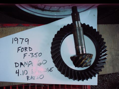 1984 Ford Bronco - A differential gear set and pinion are shown with handwritten labels indicating their origin and ratio.