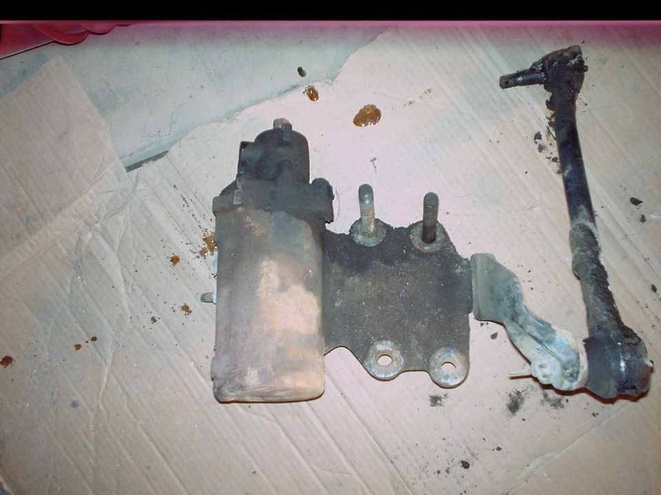 Steering linkage and power steering component on cardboard