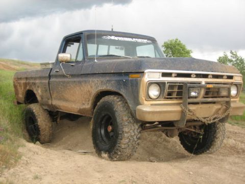 1995 Ford Bronco - This heavily muddied Ford F-Series truck appears to be from the early to mid-1970s, not a 1995 Bronco.