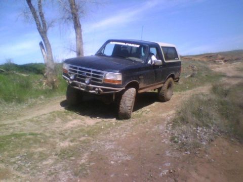 1995 Ford Bronco - This Ford Bronco is equipped with an aftermarket bumper and off-road tires, ready for adventure.