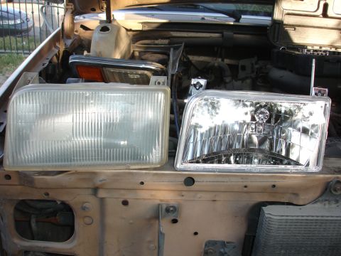 1992 Ford F-350 - Comparison of two headlights, one clear and one cloudy, placed on the engine bay of a vehicle.