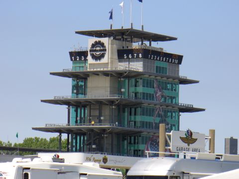 1991 Ford Probe - The iconic Indianapolis Motor Speedway pagoda stands tall against a clear blue sky, displaying race information on its scoreboards and cele…