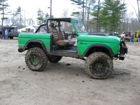 1977 Ford Bronco - This modified SUV is covered in mud, suggesting it has been used for off-roading.