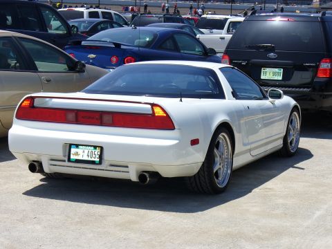 1991 Ford Probe - This white Acura NSX is seen from the rear, custom wheels and an aftermarket exhaust system.